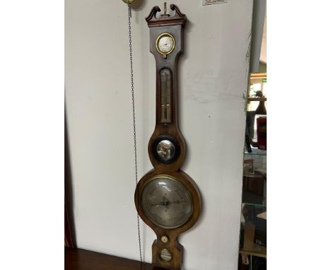 A Georgian Mahogany wall barometer/ Thermometer. Has original Mercury still intact. 