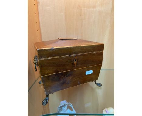 A Nice example of a Georgian/ Victorian tea caddy box, designed with lion head and hoop handles. Four claw brass feet. Has or