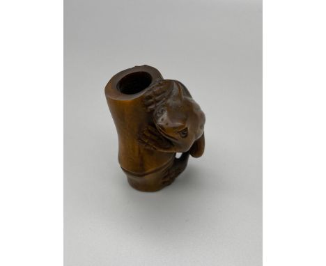 Japanese hand carved netsuke of a Frog climbing a bamboo trunk. Frog has black bead eyes and is signed by the artist. [5cm] 