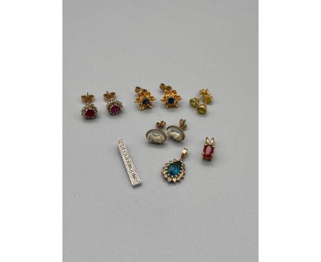 A Lot of 4 pairs of 9ct gold and gem stone earrings, which includes Ruby and diamond heart shaped earrings, Together with thr