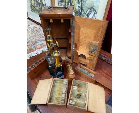 Antique brass microscope by E Leitz Wetzlar No.53447. Comes with fitted carry box which contains various accessories.  Additi