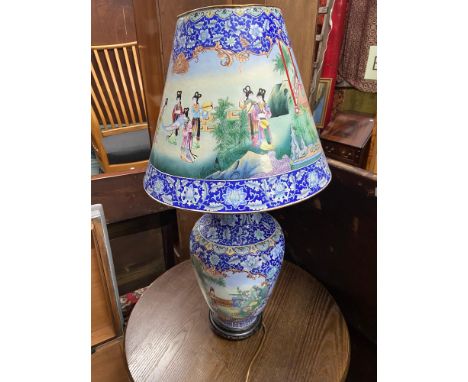 A Large Chinese enamel painted table lamp. Enamel painted on copper. Highly detailed paint work depicting geisha's interactin