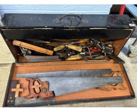 A wooden box of wood working tools