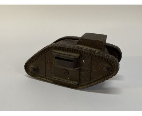 An early 20th Century cast iron novelty money bank in the form of an army tank, L 16cm