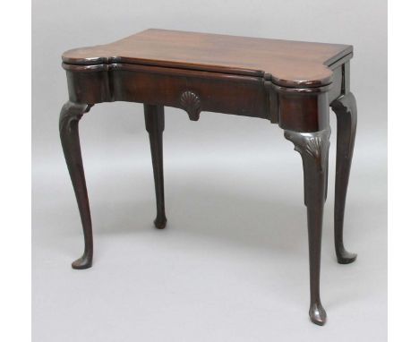 GEORGE II MAHOGANY FOLD OUT CARD TABLE, the shaped rectangular top enclosing a baize line interior with counter wells and dis