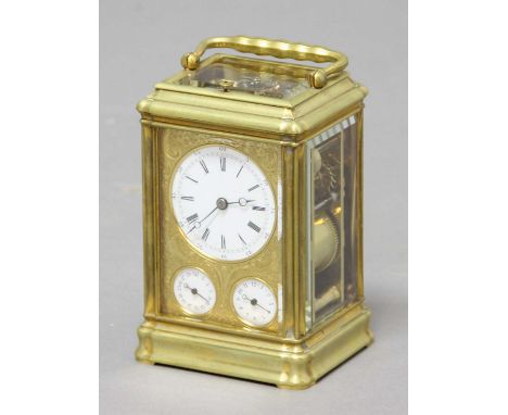 FRENCH GILT BRASS FOUR PANE CARRIAGE CLOCK,  by Drocourt, the enamelled dial above subsidiary date and alarm dials in a frame