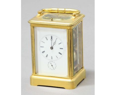 FRENCH GILT BRASS FOUR PANE CARRIAGE CLOCK,  circa 1870, the enamelled dial with subsidiary alarm dial on a brass, eight day 