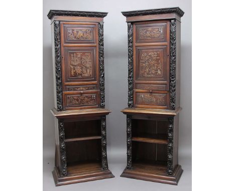 PAIR OF CHINOISERIE ALCOVE CABINETS, the two panel doors carved in relief with scenes above a further single panel, some with
