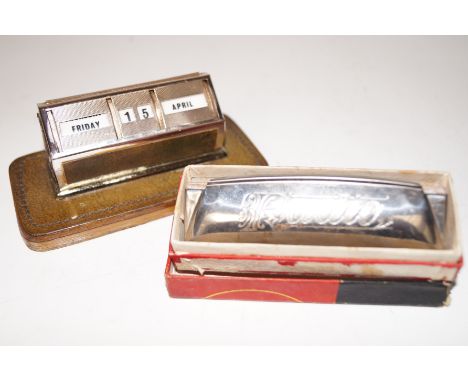 Perpetual calendar together with a harmonica 