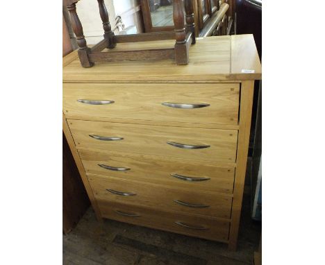 A modern light Oak four drawer chest