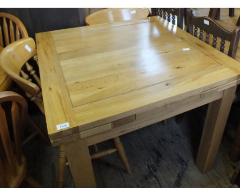 A modern light Oak kitchen table 