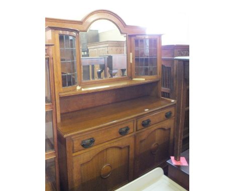 An light Oak mirror back and lead glazed sideboard