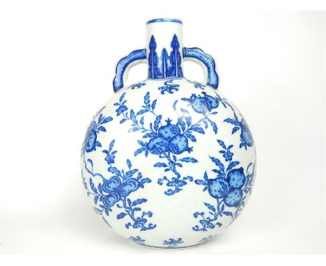 An attractive, Chinese, blue and white moon flask decorated on both sides with hand-painted bunches of pomegranates and other