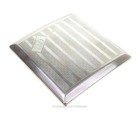 An Art Deco sterling silver cigarette case, James Dixon & Sons Ltd, Sheffield 1927, it has engine turned decoration and a mon