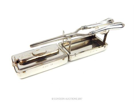 A pair of Edwardian sterling silver curling irons together with a box, William Davenport, Birmingham 1902, the handles of the