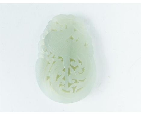 A 20th century, Chinese, white jade, carved pendant depicting a standing phoenix with coiling plumage. Dimensions: 6 x 4 cm.
