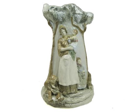 An Austrian 'Amphora' stick stand, in the form of a mother and her children, impressed stamps to the base, 55 x 29 x 21cm.