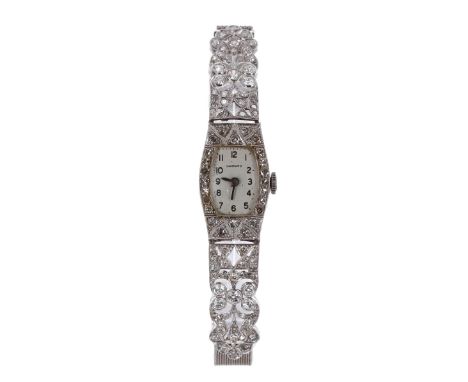 Fine Garrard 1920s platinum and diamond lady's cocktail watch, tonneau silvered dial with Arabic numerals, 17 jewel movement,