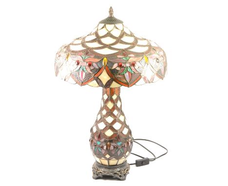 Large modern leaded and stained glass table lamp, in the Tiffany style, canopy-shaped shade on a similar slightly swollen bas