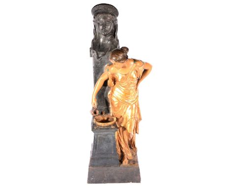 A large Art Nouveau terracotta figure by a fountain, by Goldscheider, late 19th century, patinated and gilt finish, the maide