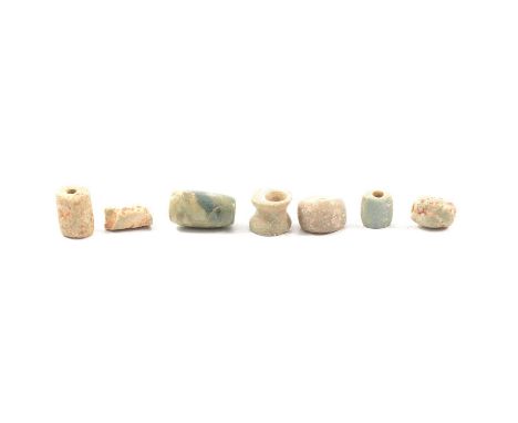 A collection of ancient pre-Colombian jade beads, range of sizes and shapes, two with groove decoration.Qty: 1 box