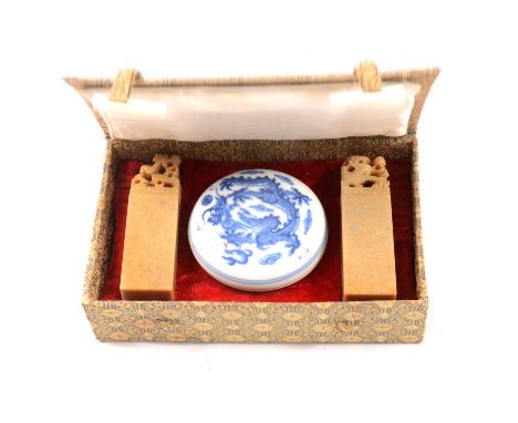 Modern Chinese wax seal set, with porcelain circular dish and cover, and two carved stone seals, wax dish 7cm diameter.