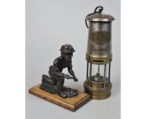 Miners lamp together with a miner figurine