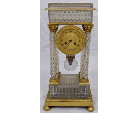 A French Empire Portico clock,four crystal column supports mounted with ormolu Corinthians with eight-day movement striking o