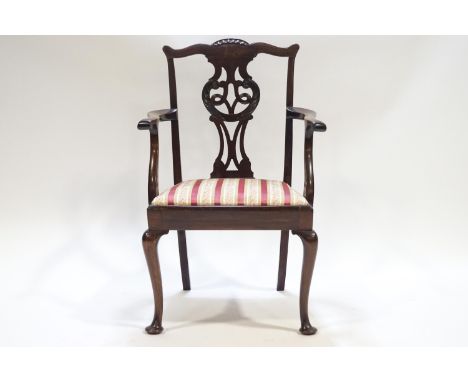 A child's mahogany Chippendale style carver with pierced and carved splat over a drop in seat on cabriole legs