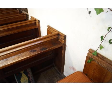 A Victorian pine pew with triple paneled back and prayer book shelf to reverse with one wall end 83cm high, 271cm wide, 48cm 