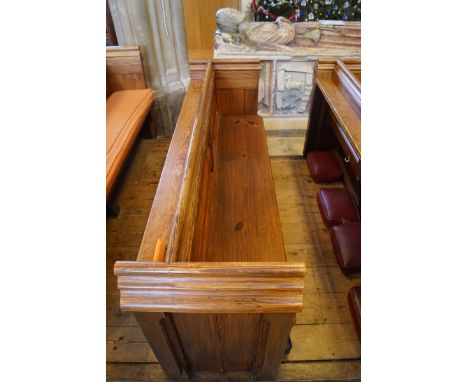  A Victorian pine pew with triple paneled back and prayer book shelf to the reverse (drilled hole) 83cm high, 278cm wide, 47.