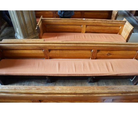 A Victorian pine pew with double paneled back and prayer book shelf to the reverse 83cm high, 209cm wide, 47cm deepPlease Not