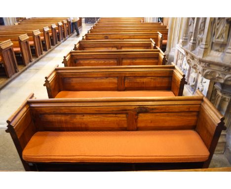 A Victorian pine pew with doubled paneled back and prayer book shelf to the reverse, 83cm high, 177cm wide, 47.5cm deepPlease
