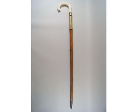 A malacca walking stick with brass mount and simulated ivory handle, 81cm long