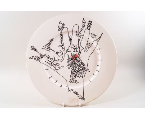 A Poole pottery plate decorated with a design by Uri Geller, applied factory mark, and signed 32.5cm diameter