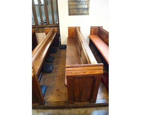 A Victorian pine pew with triple paneled back and prayer book shelf to reverse with one wall end 83cm high, 271cm wide, 48cm 