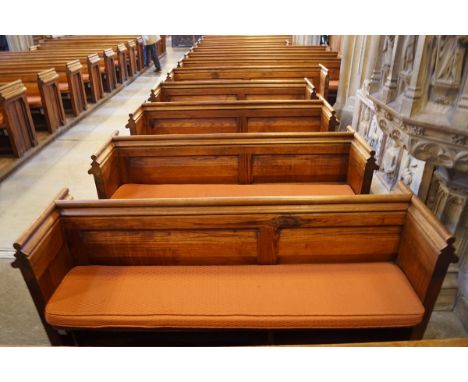 A Victorian pine pew with double paneled back and prayer book shelf to the reverse (drilled hole) 83cm high, 211cm wide, 47.5