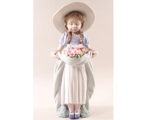 Lladro 6756, 'Bountiful Blossoms', a girl holding a basket of flowers, 24cm high