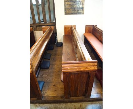 A Victorian pine pew with triple paneled back and prayer book shelf to reverse with one wall end 90cm high, 271cm wide, 48cm 