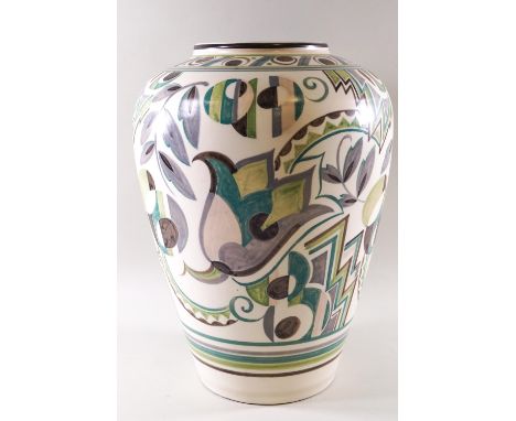 A large Poole pottery vase of tapering cylindrical form, the body profusely decorated with art deco style lotus blossoms in a