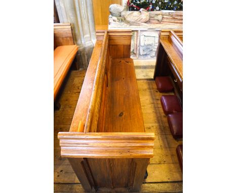 A Victorian pine pew with doubled paneled back and prayer book shelf to the reverse, 83cm high, 177cm wide, 47.5cm deepPlease