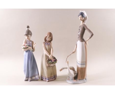 Lladro 5604, 'Spring Token', a girl with a bunch of flowers and two others, 19cm high