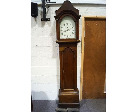 An 18th century oak long case clock with white painted arched dial to pillared hood enclosing an eight day movement, 227cm hi