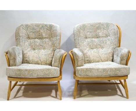 A pair of Ercol bent beech wood Windsor style arm chairs with attached pads, 82cm high x 81cm wide x 88cm deep (one label def