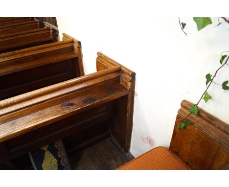 A Victorian pine pew with triple paneled back and prayer book shelf to reverse with one wall end 83cm high, 271cm wide, 48cm 