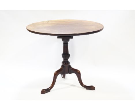 A George III style mahogany tripod table, with bird cage top to pedestal base, 73.5cm high, 83cm diameter