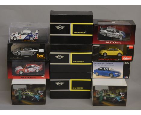 Eleven boxed diecast models in 1:43 scale, by Schuco Autoart, IXO and others with various marques represented including Aston