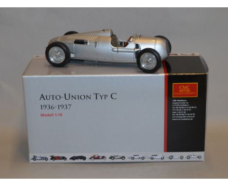 A boxed CMC diecast model Auto-Union Type C 1936-1937,1:18 scale in silver, VG in G+/VG box.