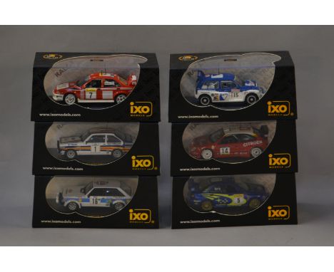 Six boxed diecast model Rally cars in 1:43 scale by IXO, including a  Talbot Lotus Sunbeam. Models appear VG in generally VG 