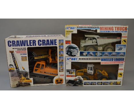 Three 'Hobby Engine' plastic battery operated radio control models, a Crawler Tractor (1:12 scale), a Four Wheeled Loader (1: